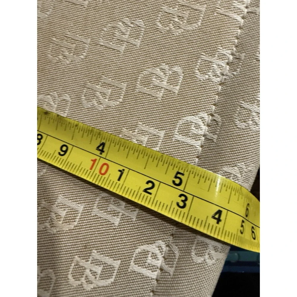 Dooney and Bourke Beige Canvas and Leather Signature Tassel Tote Handbag‎